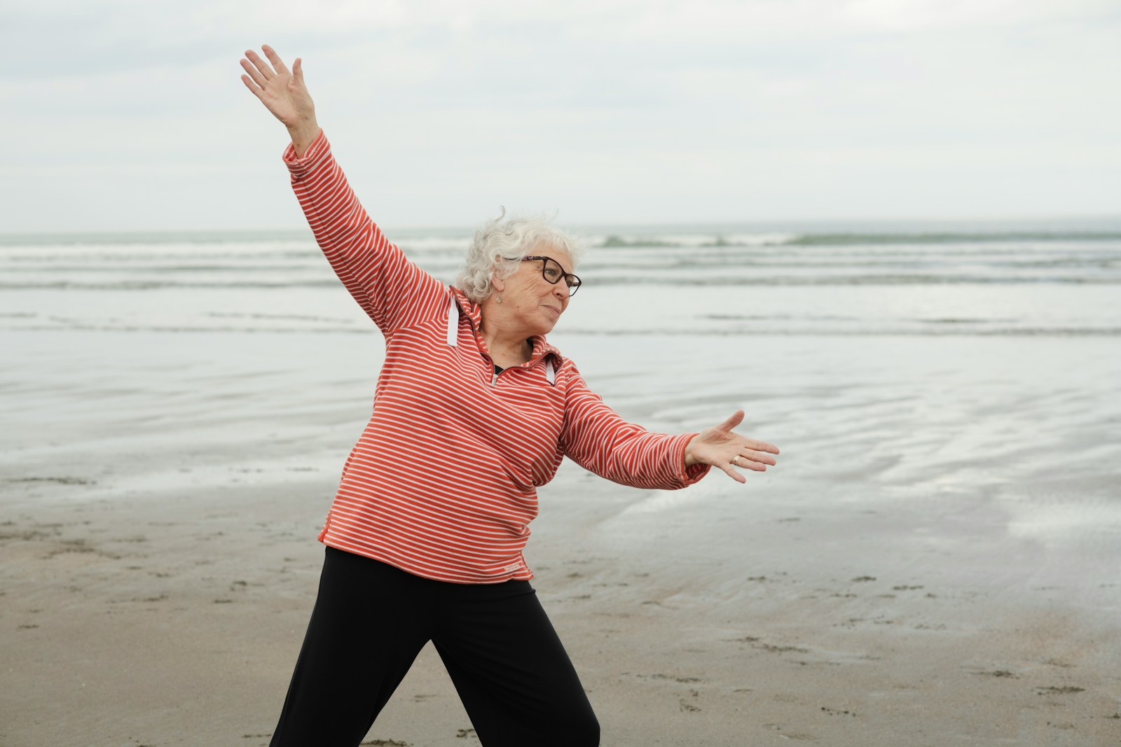 A woman full of energy, laughing on a morning walk with a friend